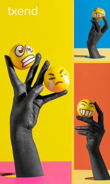 black hand holding emoji balls