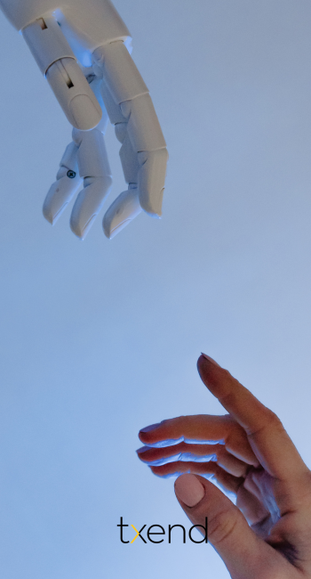 human hand and robotic hand infornt of each other 